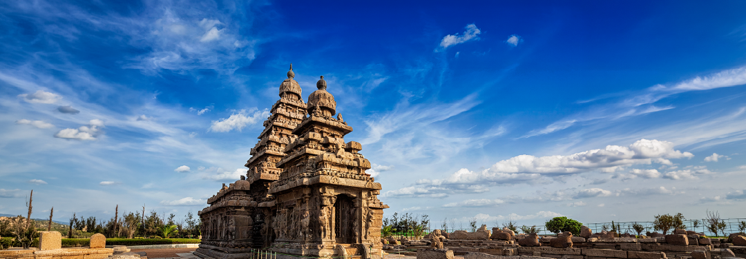Brihadisvara Temple in Thanjavur, Tamil Nadu, featuring its towering Dravidian-style granite vimana beneath a blue sky.