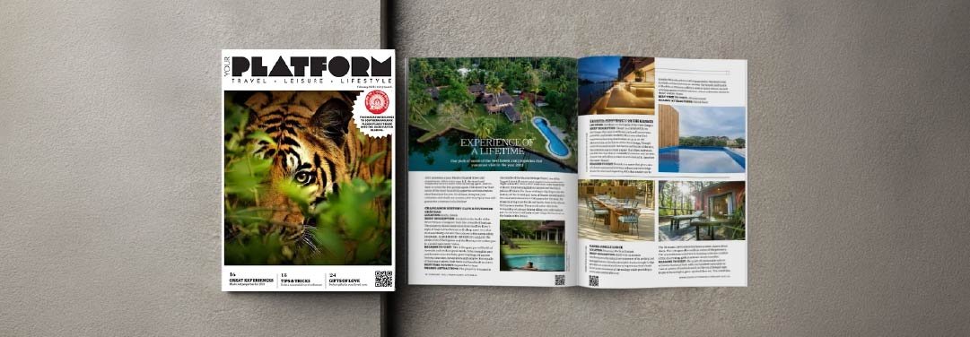 Your Platform February 2023 magazine edition featuring a tiger in the wild on the cover and an inside travel editorial titled Experience of a Lifetime, showcasing luxury nature resorts.