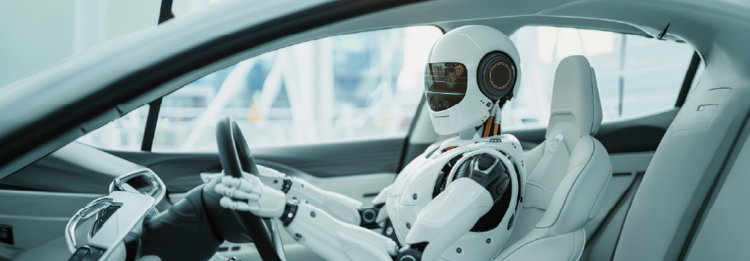 Futuristic humanoid robot sitting behind the steering wheel of a modern car, illustrating artificial intelligence and autonomous driving technology.